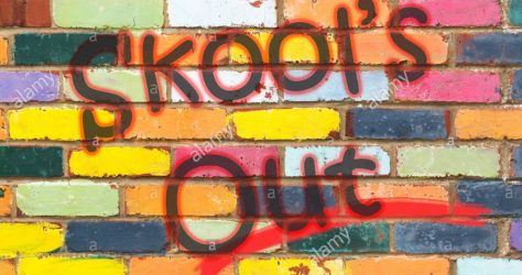 looking-at-a-very-colourful-brickwall-with-the-wording-skools-out-dorset-england-MCFBJ9